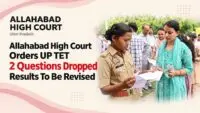 Candidates queue at a UP TET exam centre as the Allahabad High Court orders marks to be recalculated